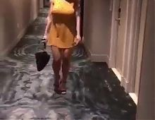 Hot blonde undresses totally walking along hotel corridor 